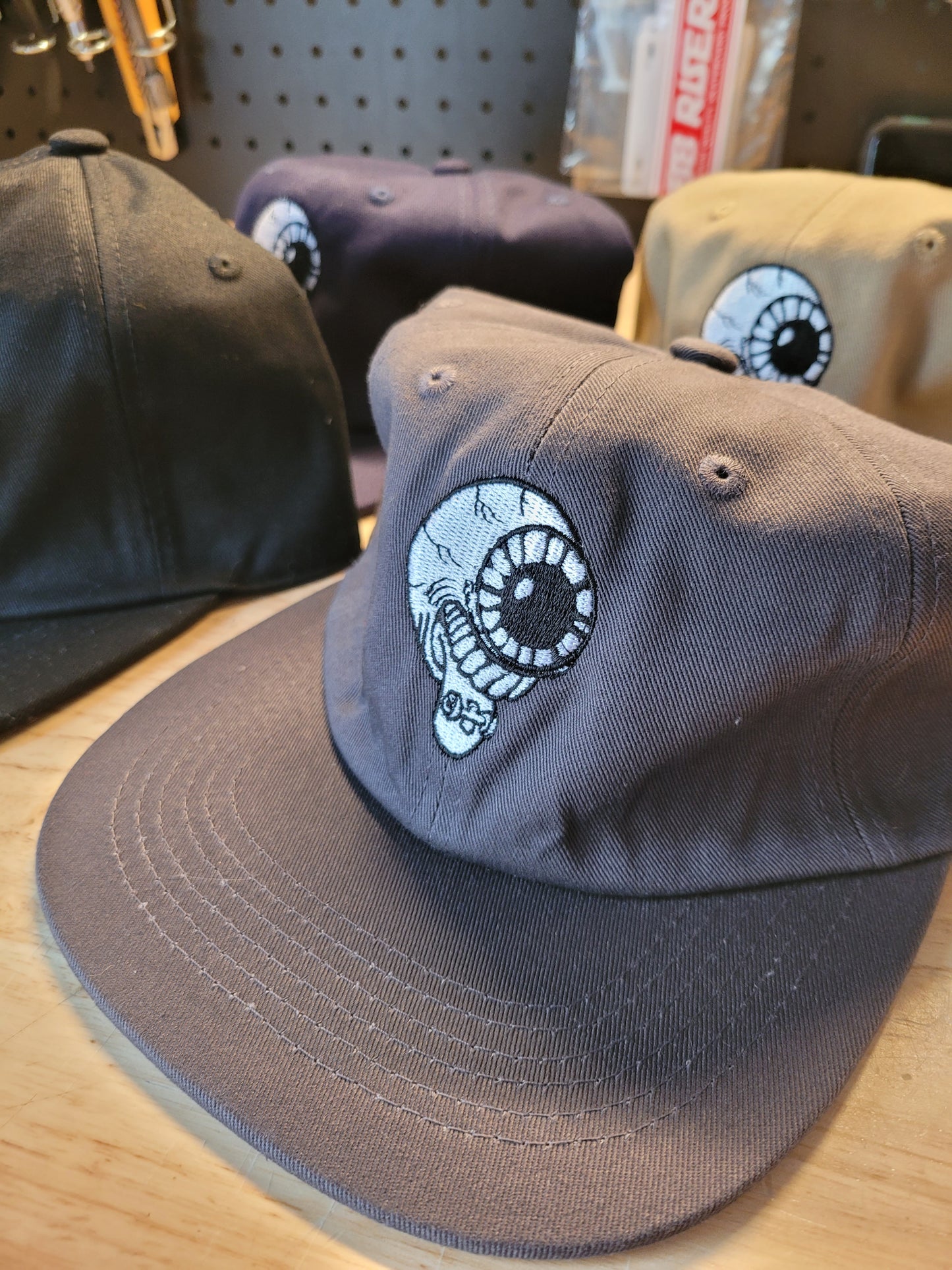 Retna - Eye Logo Hats
